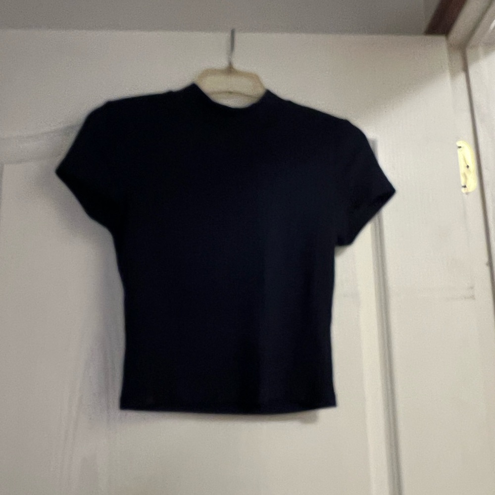 Plain high neck top.